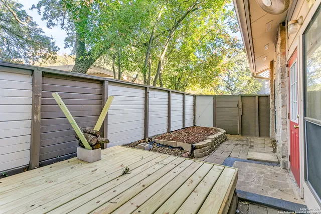 a front view of a building with a yard