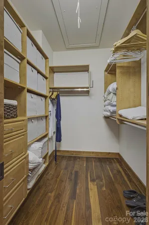 a bathroom with a glass door shower and a sink