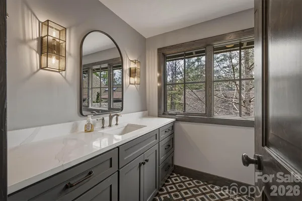 a kitchen with stainless steel appliances granite countertop a sink and stove