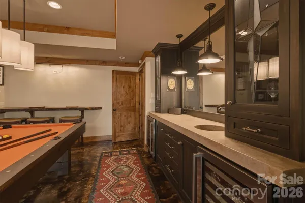 an aerial view of a houses with a lake view