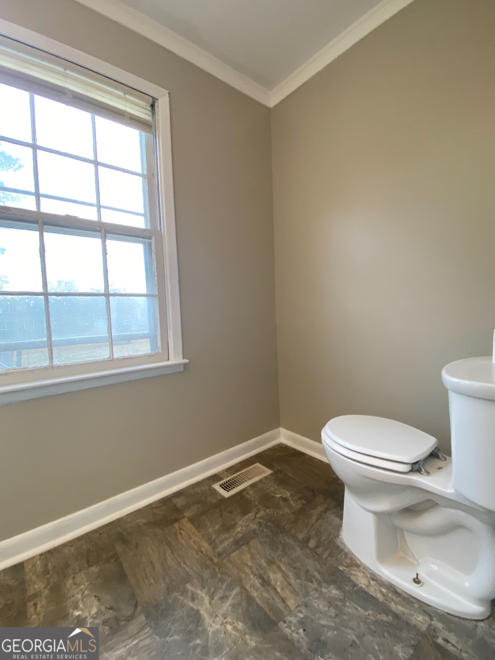 117 Laura Lane Fort Valley, GA 31030 - Photo 12 of 28 a white toilet sitting next to a window in a bathroom