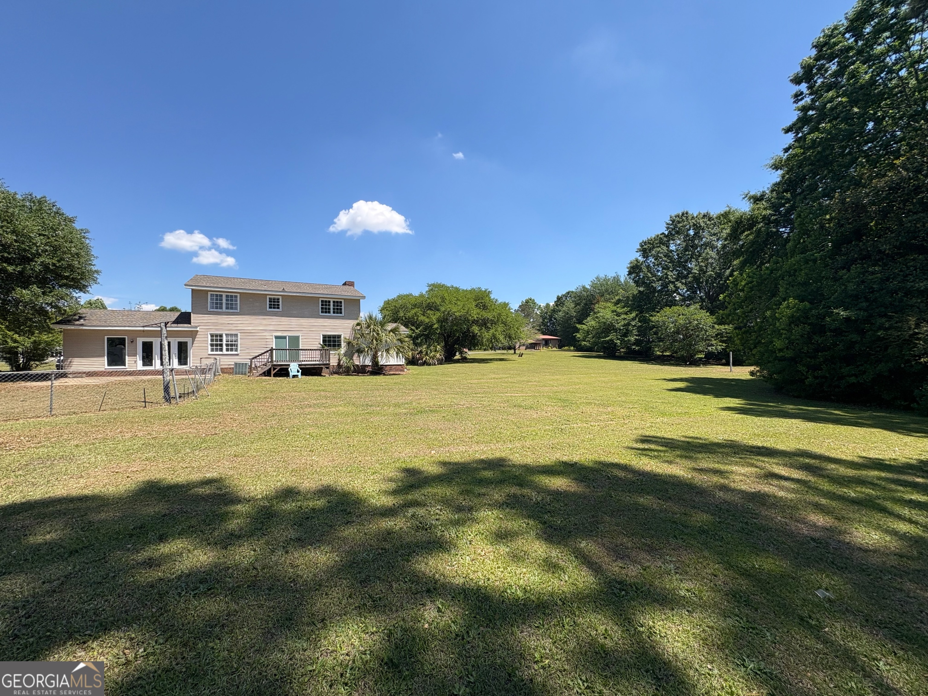 117 Laura Lane Fort Valley, GA 31030 - Photo 23 of 28 a view of a swimming pool with an outdoor seating and a yard