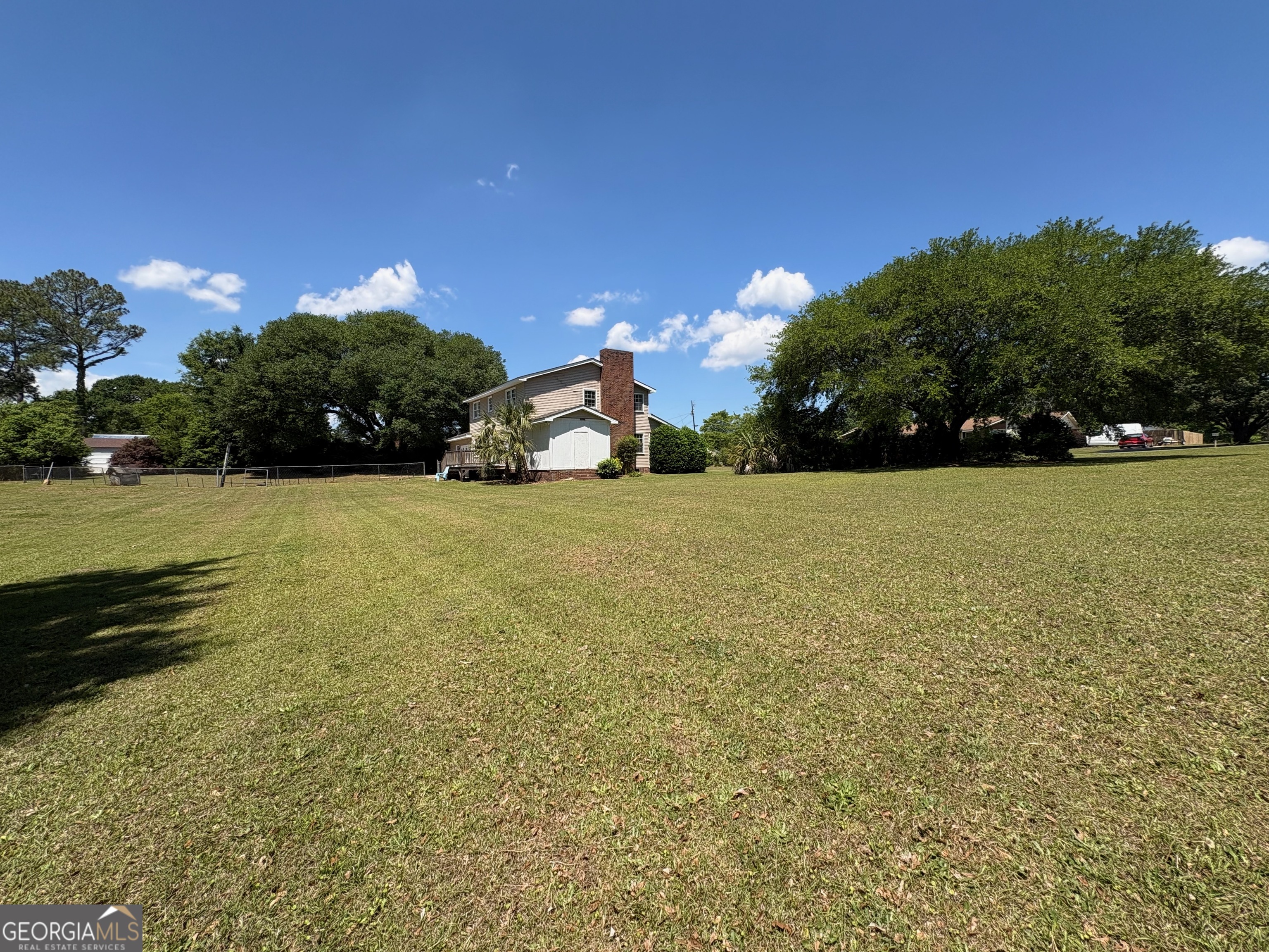 117 Laura Lane Fort Valley, GA 31030 - Photo 24 of 28 a view of a yard with a house in the background