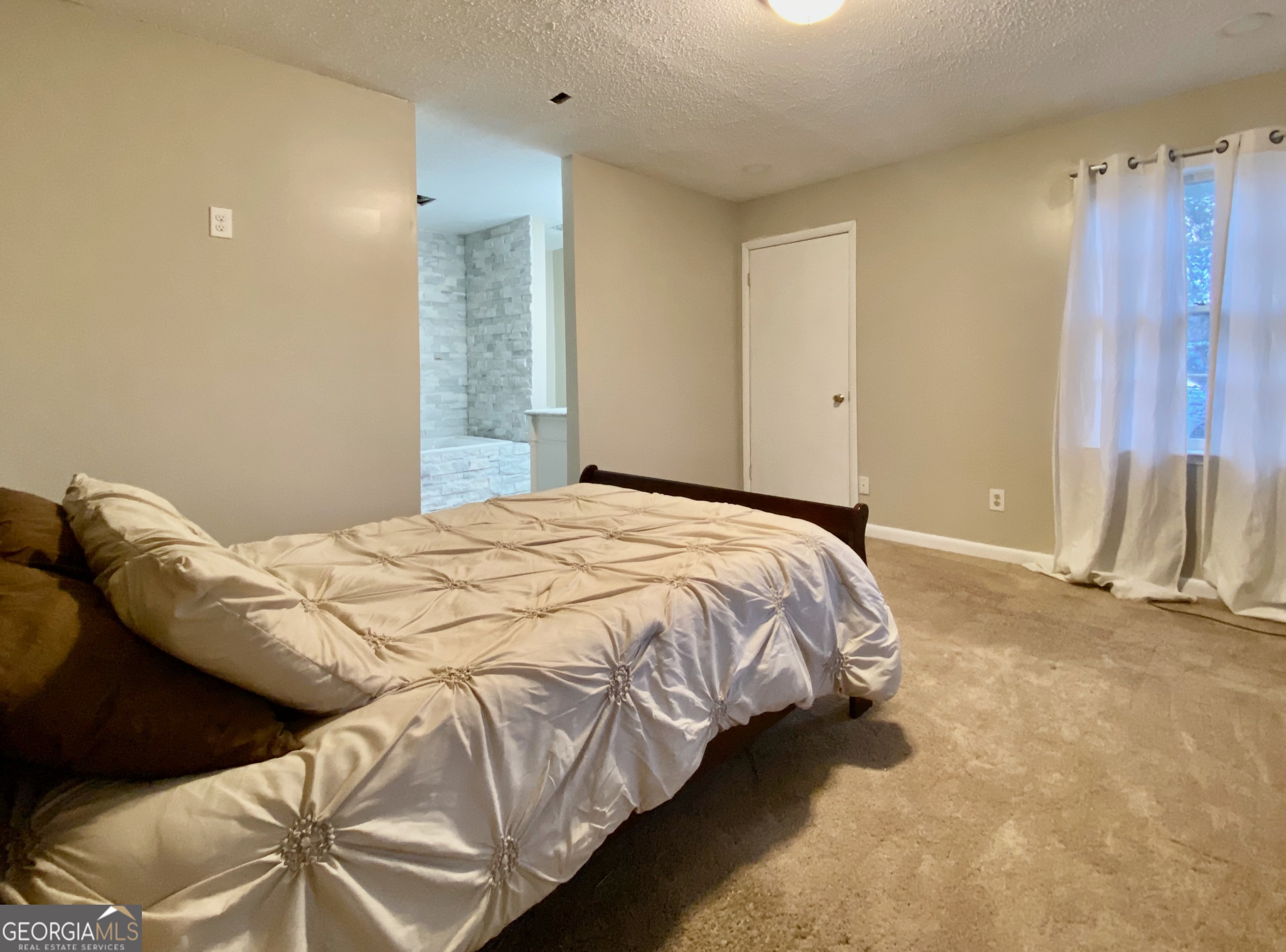 117 Laura Lane Fort Valley, GA 31030 - Photo 8 of 28 a bedroom with a bed and a painting on the wall