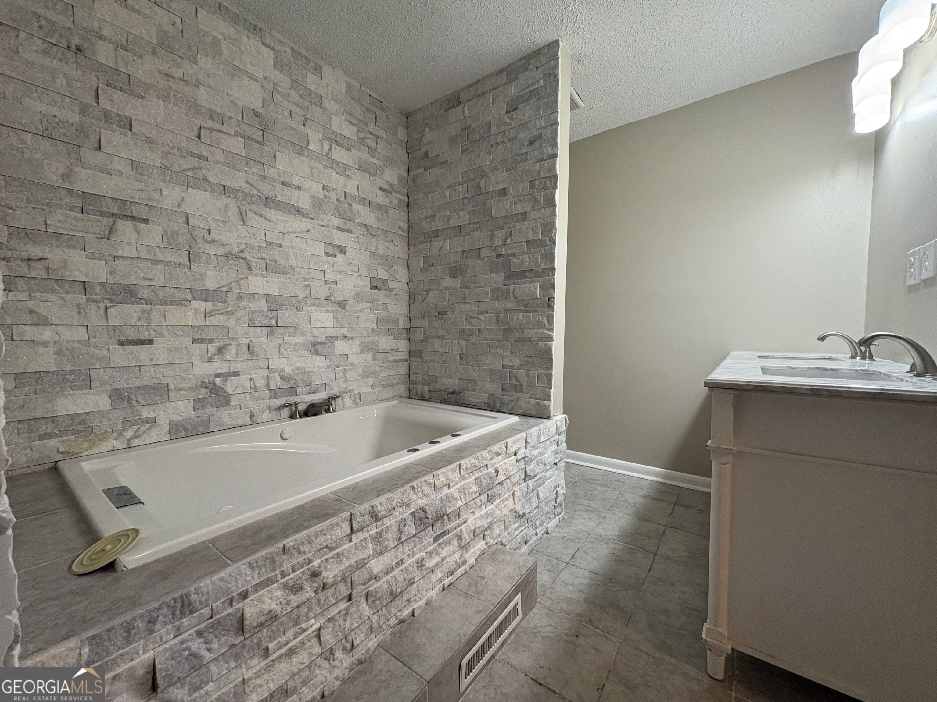 117 Laura Lane Fort Valley, GA 31030 - Photo 9 of 28 a bathroom with a tub a sink and a shower