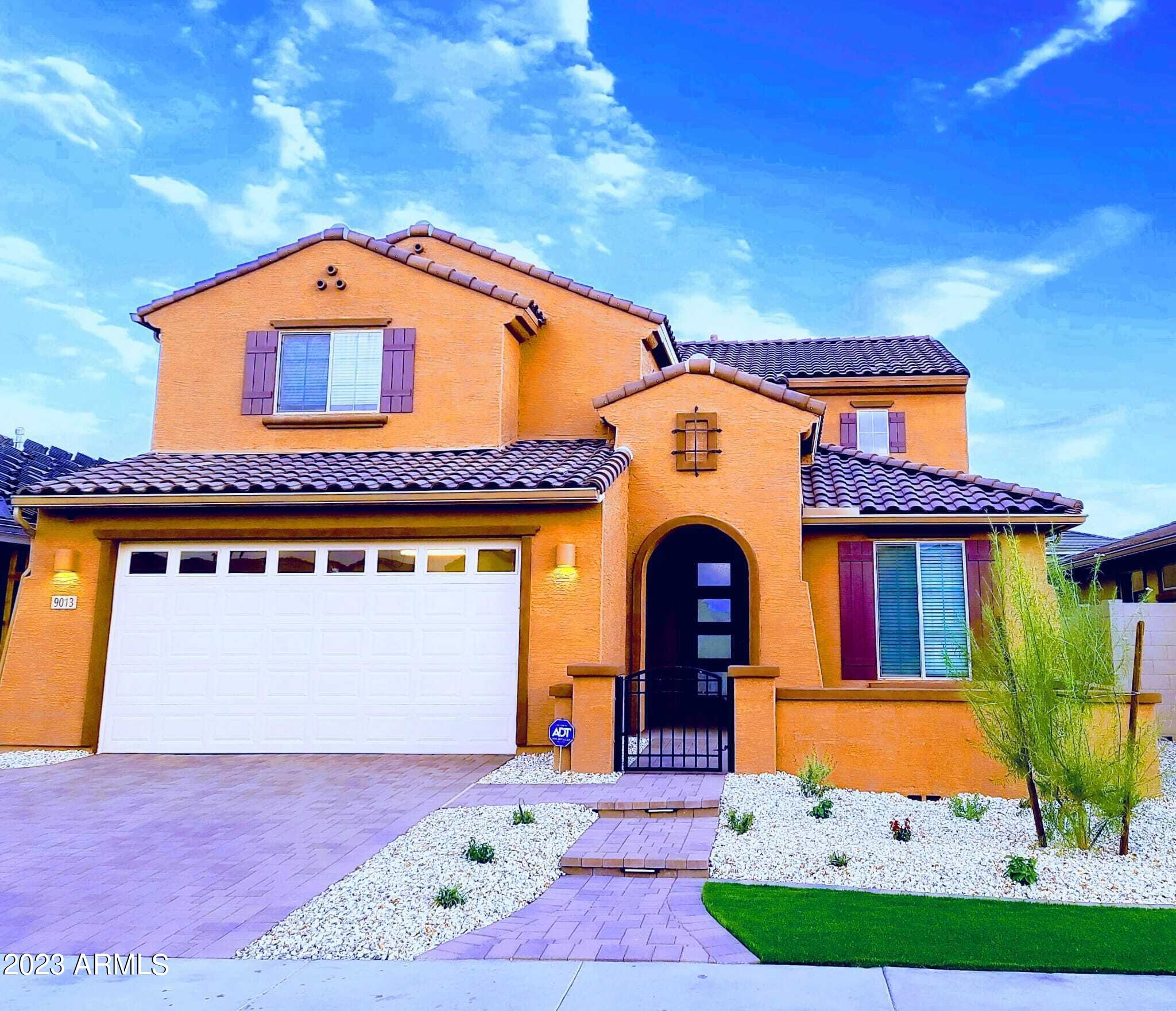 9013 West Marshall Avenue Glendale, AZ 85305 - Photo 1 of 22 a front view of a house with garden