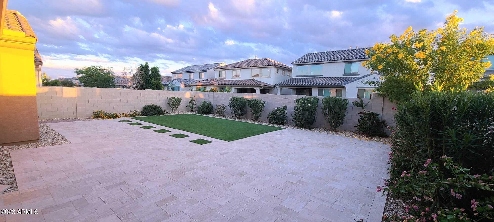 9013 West Marshall Avenue Glendale, AZ 85305 - Photo 12 of 22 a view of a house with a yard and potted plants