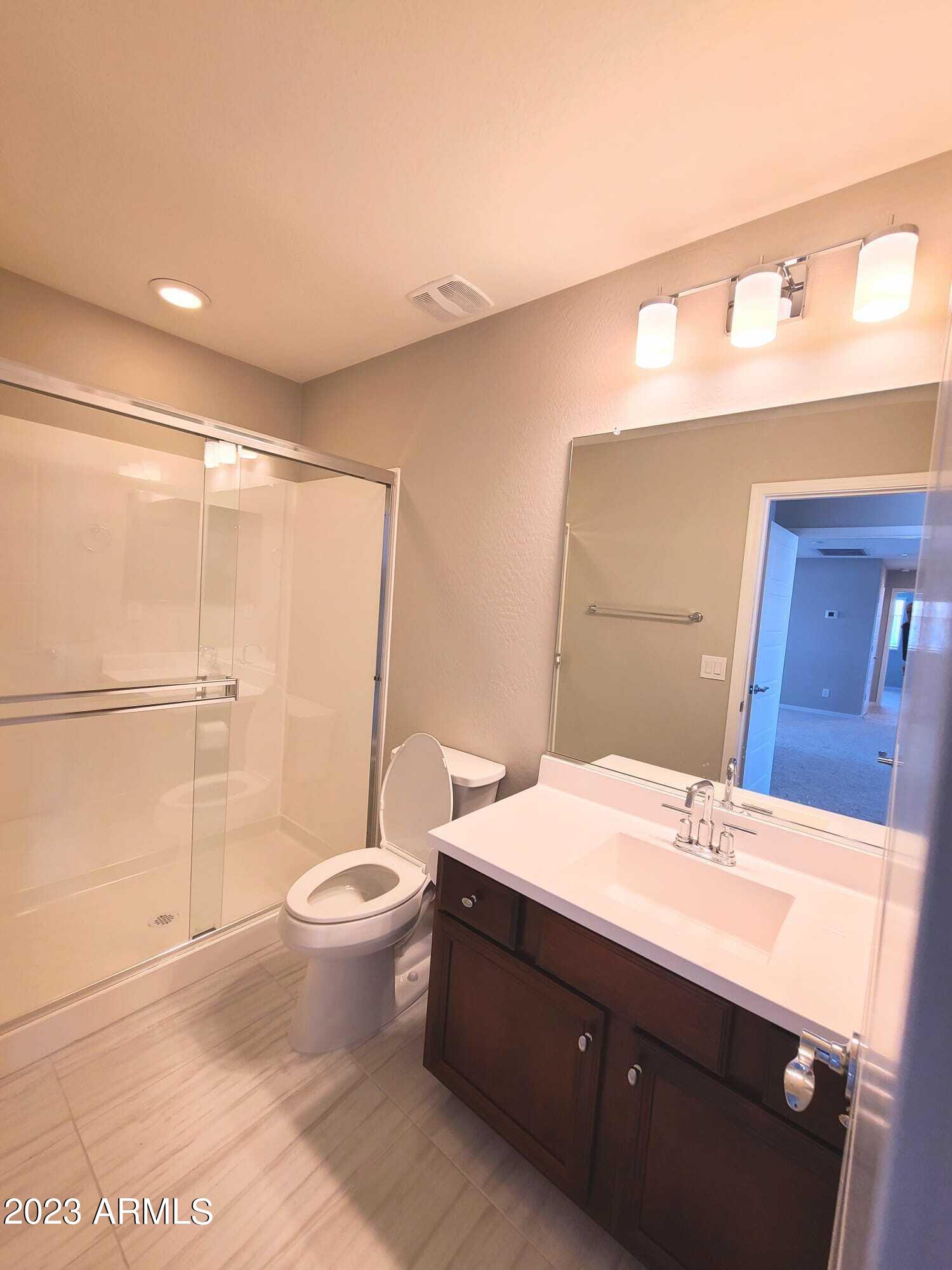 9013 West Marshall Avenue Glendale, AZ 85305 - Photo 19 of 22 a bathroom with a sink toilet and shower