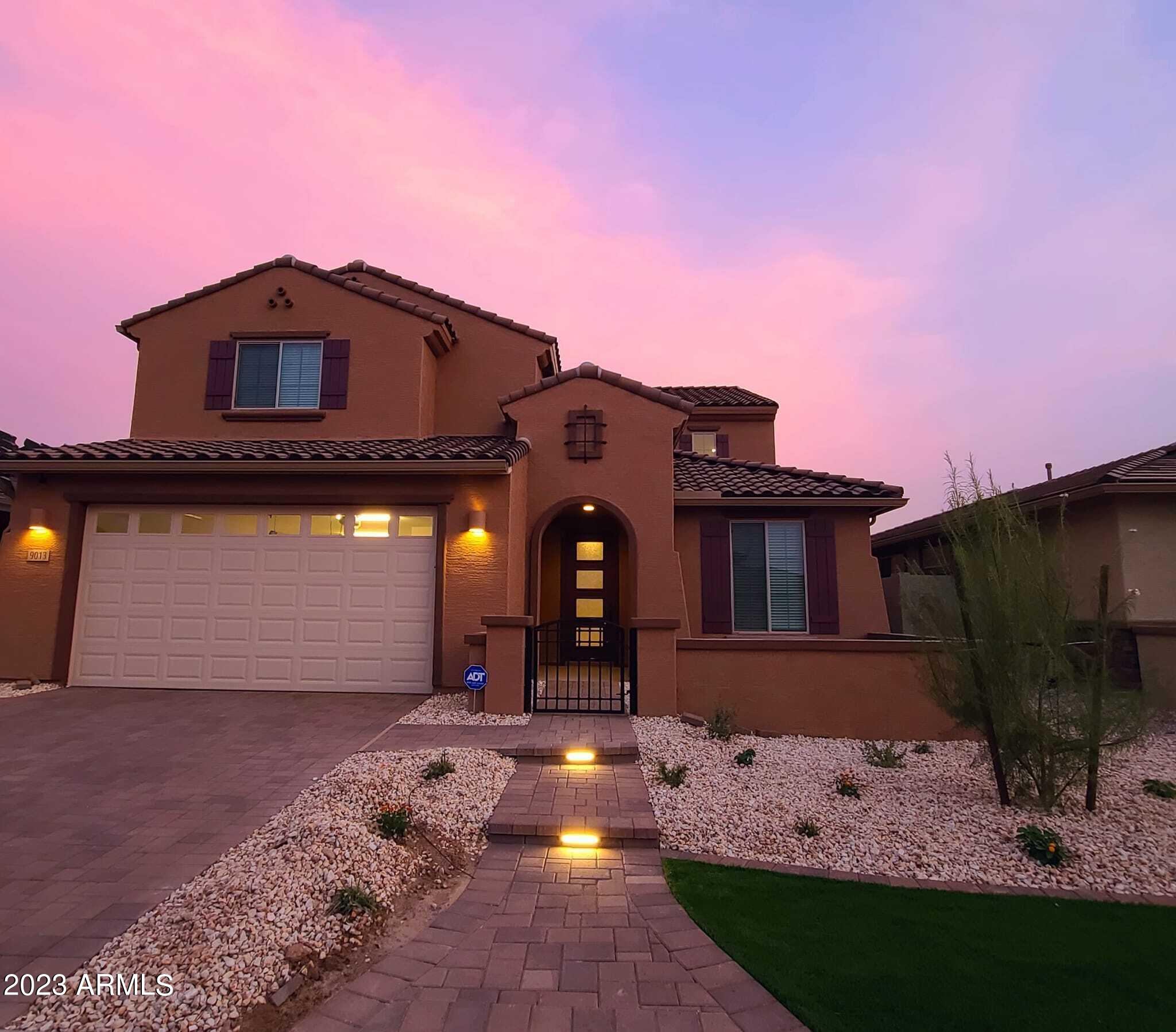 9013 West Marshall Avenue Glendale, AZ 85305 - Photo 2 of 22 a front view of a house with a yard