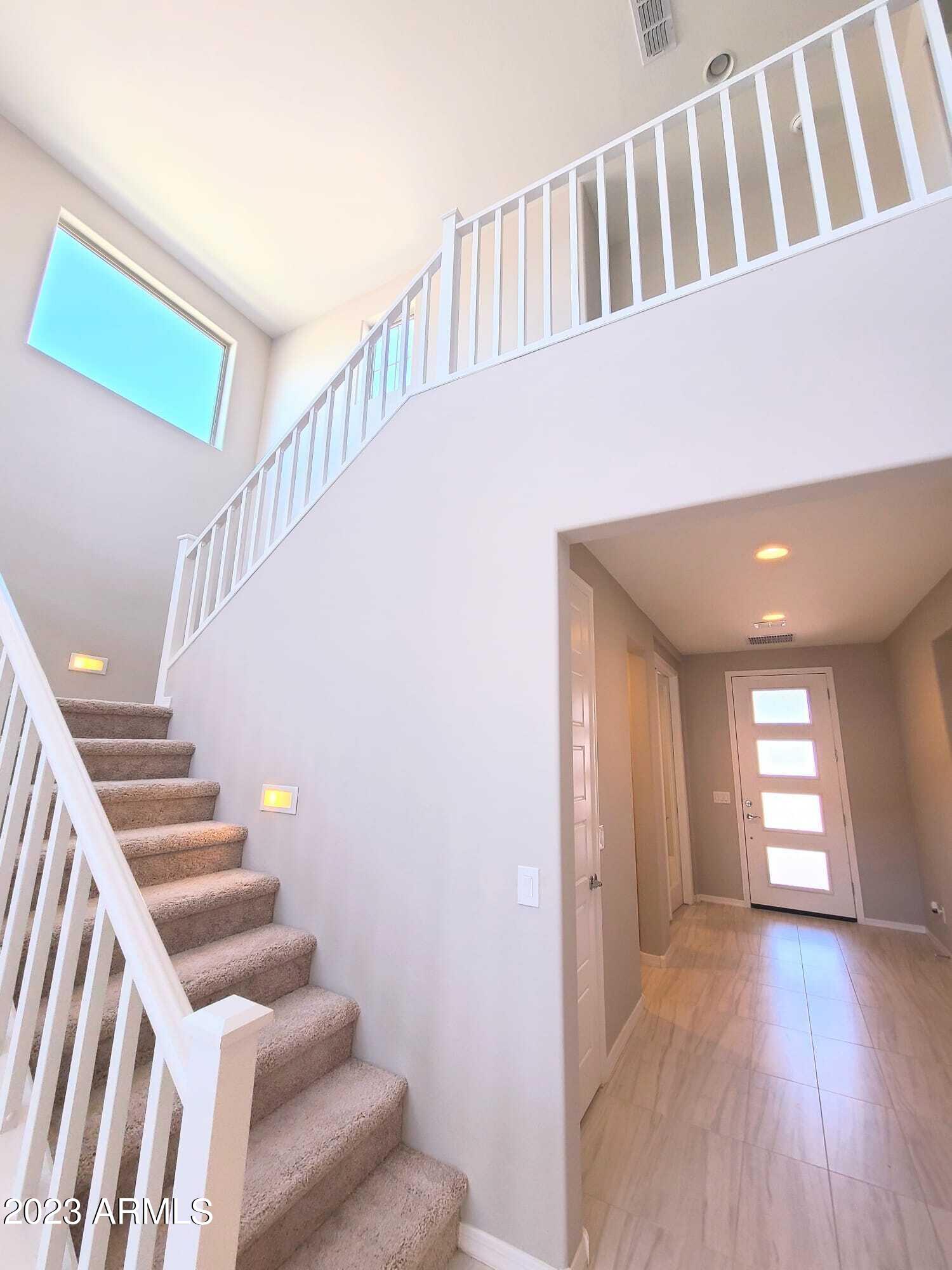 9013 West Marshall Avenue Glendale, AZ 85305 - Photo 5 of 22 a view of entryway and hall with wooden floor