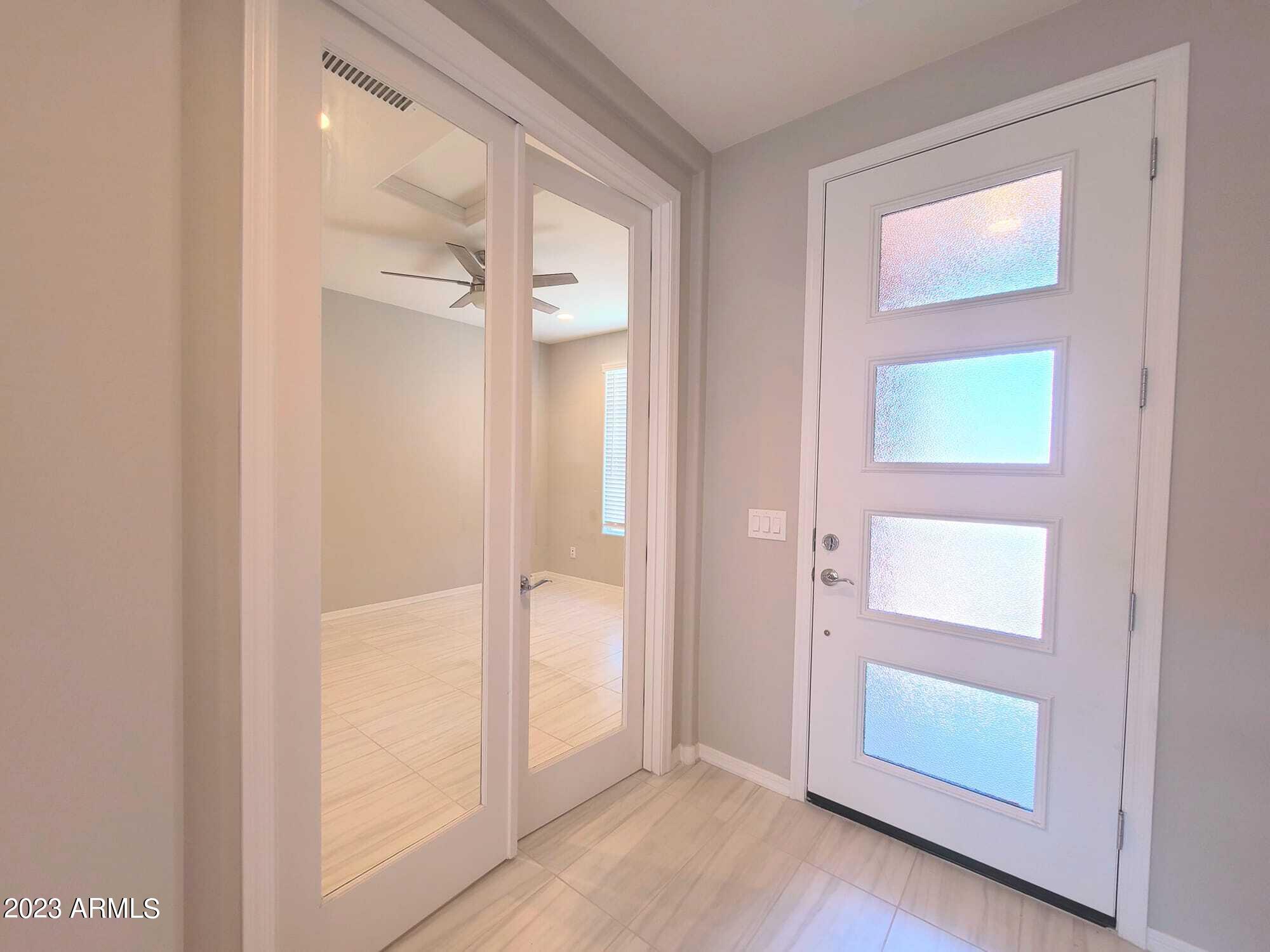 9013 West Marshall Avenue Glendale, AZ 85305 - Photo 8 of 22 an empty room with windows and closet