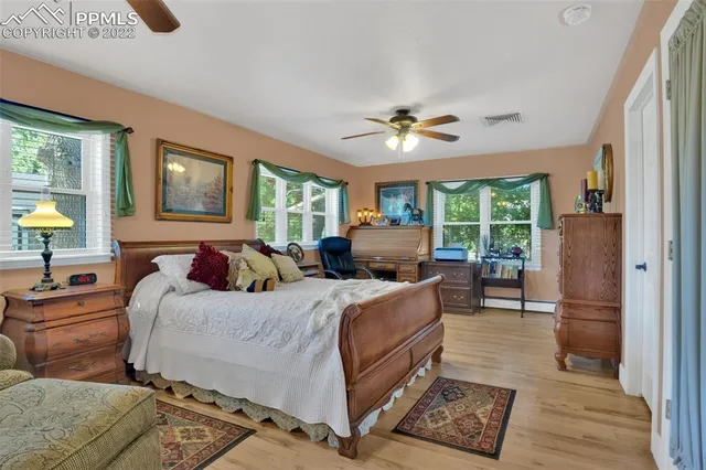 a bed room with bed and a window