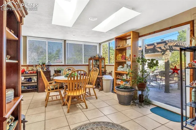 a table and chairs in front of a building