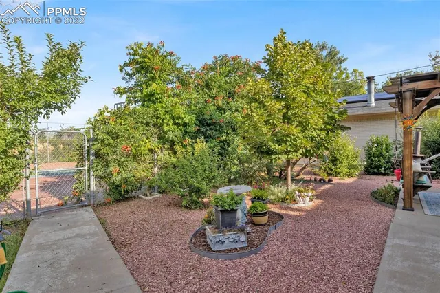 a view of a backyard with sitting area