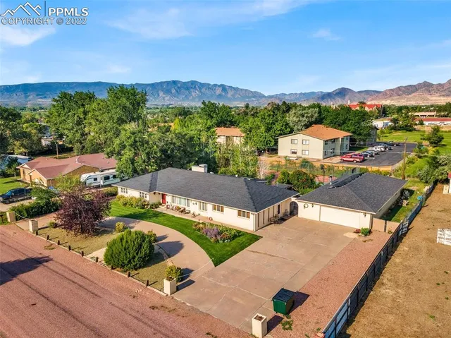 an aerial view of a house with a garden