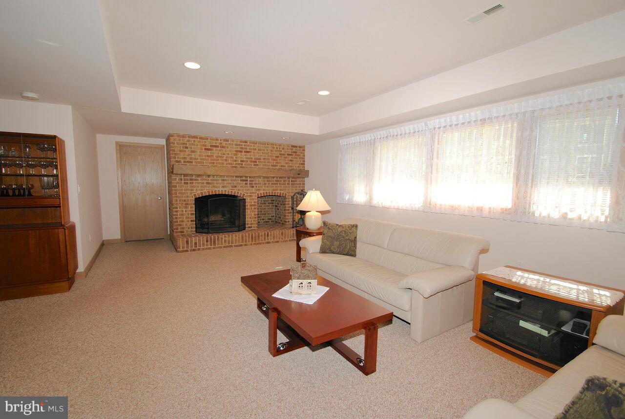 3410 Hidden River View Road Annapolis, MD 21403 - Photo 11 of 30 Fully finished walk out LL w/ brick FP