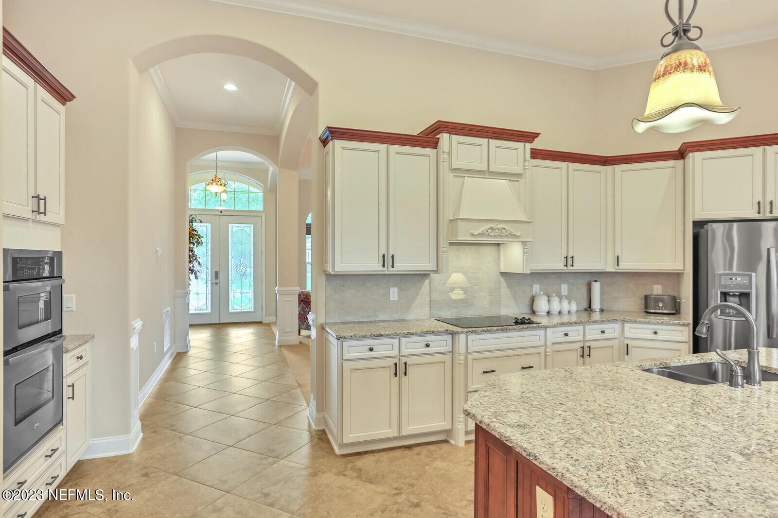 291 Ellsworth Circle St. Johns, FL 32259 - Photo 14 of 72 a kitchen with a sink refrigerator and cabinets