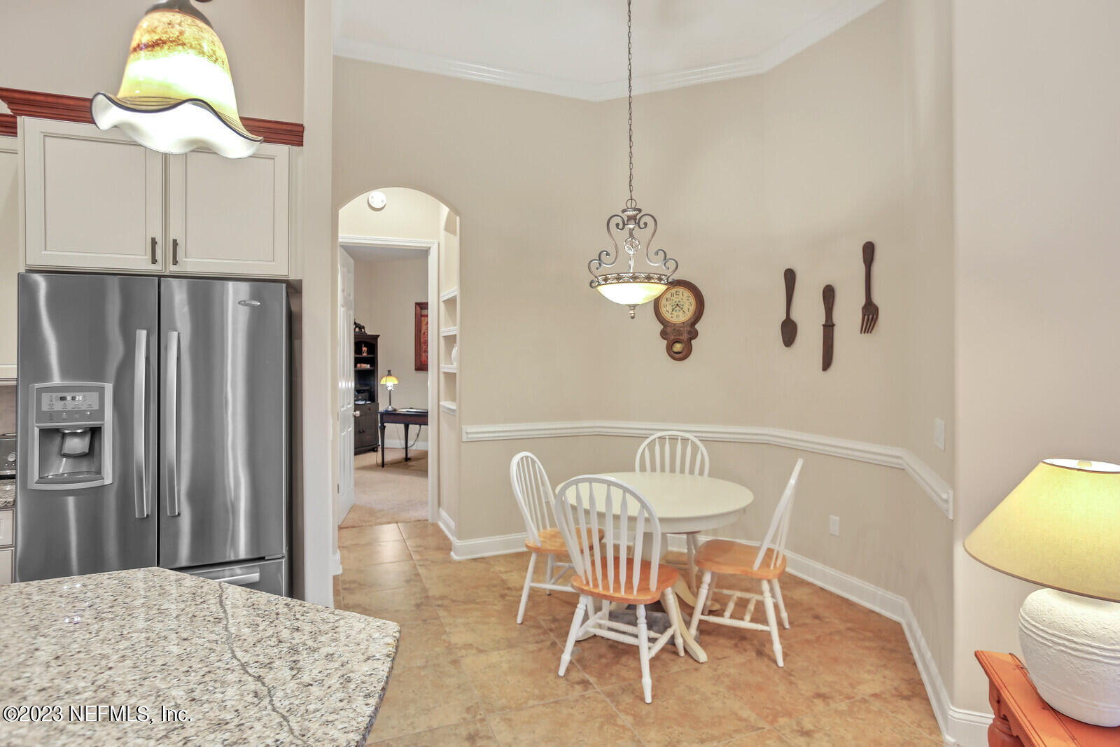 291 Ellsworth Circle St. Johns, FL 32259 - Photo 16 of 72 a dining room with wooden floor a chandelier a wooden table and chairs