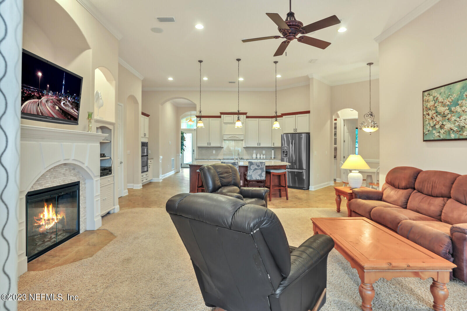 291 Ellsworth Circle St. Johns, FL 32259 - Photo 18 of 72 a living room with furniture a fireplace and a ceiling fan