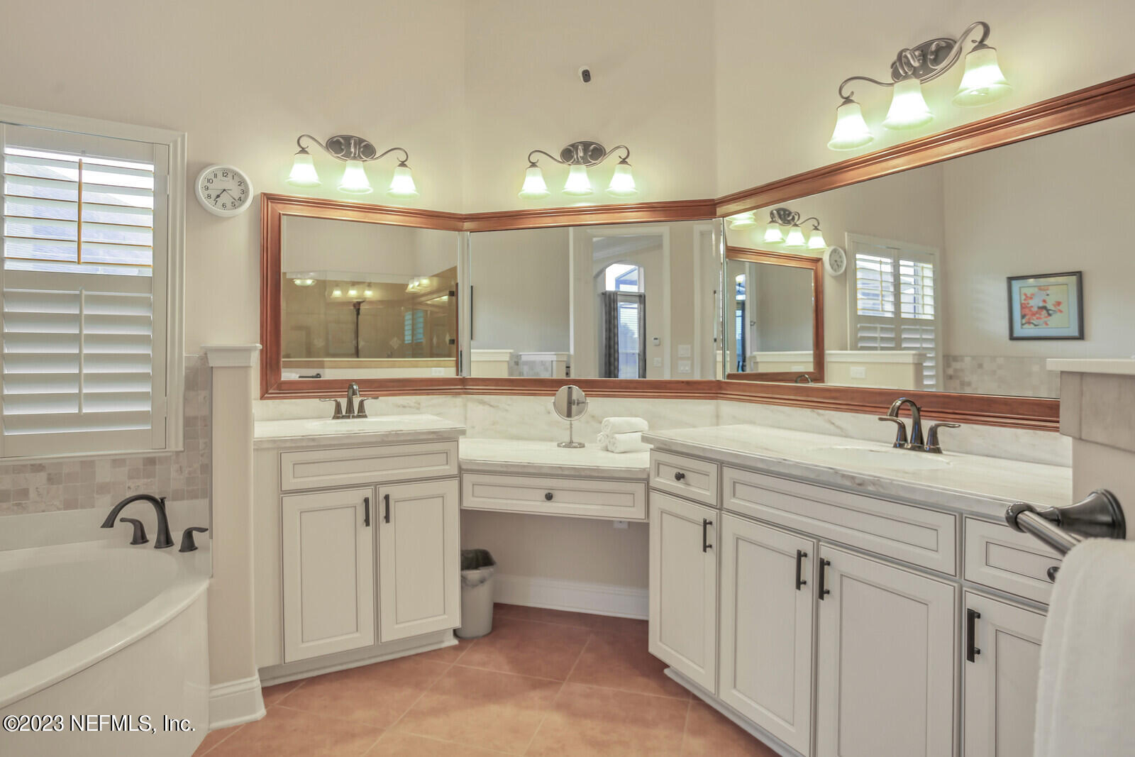 291 Ellsworth Circle St. Johns, FL 32259 - Photo 21 of 72 a spacious bathroom with a granite countertop sink a large mirror and a bathtub