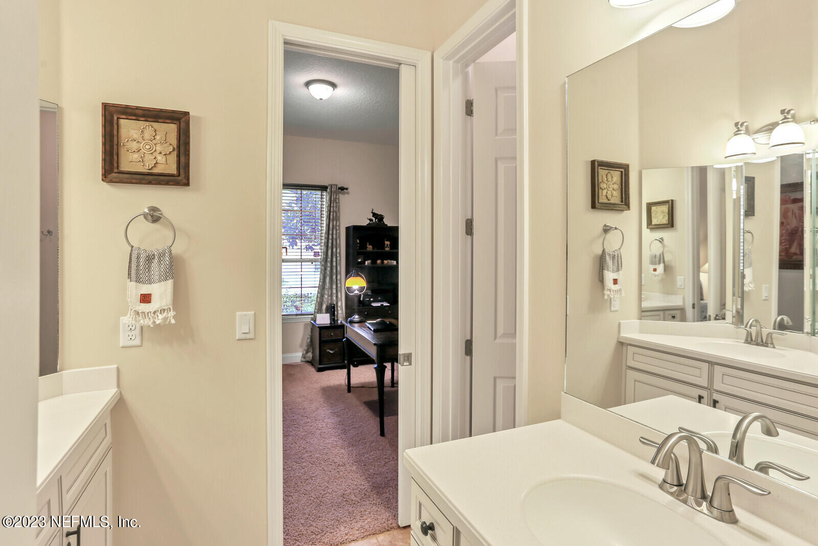 291 Ellsworth Circle St. Johns, FL 32259 - Photo 25 of 72 a en suite bathroom with a sink a mirror and a shower