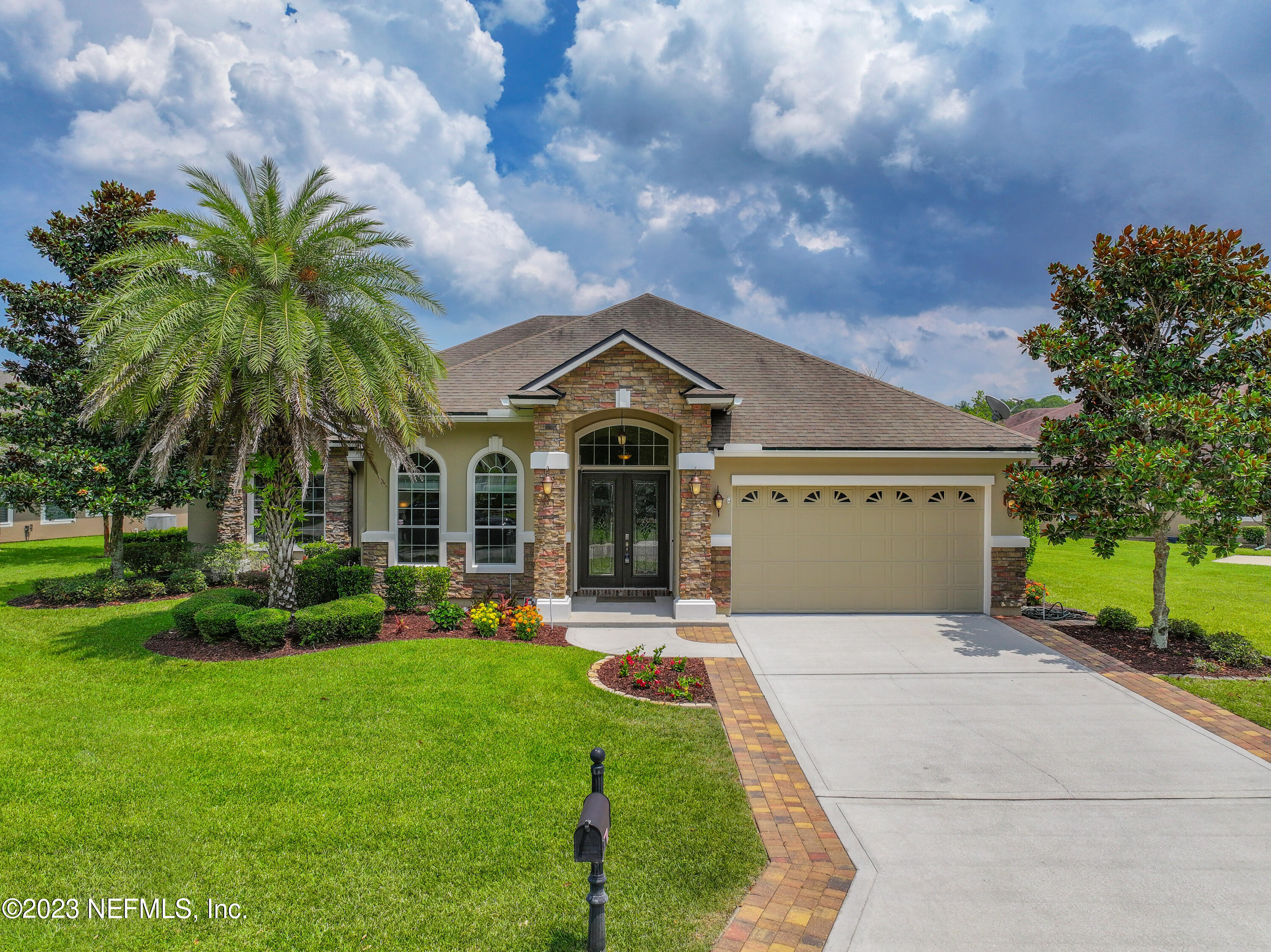 291 Ellsworth Circle St. Johns, FL 32259 - Photo 3 of 72 a front view of a house with a garden and plants