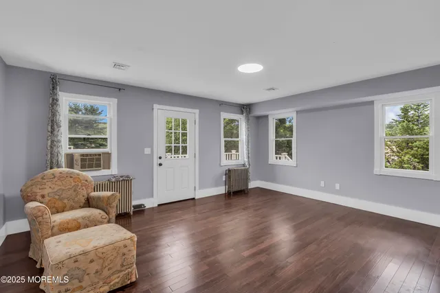 a view of livingroom with furniture and windows