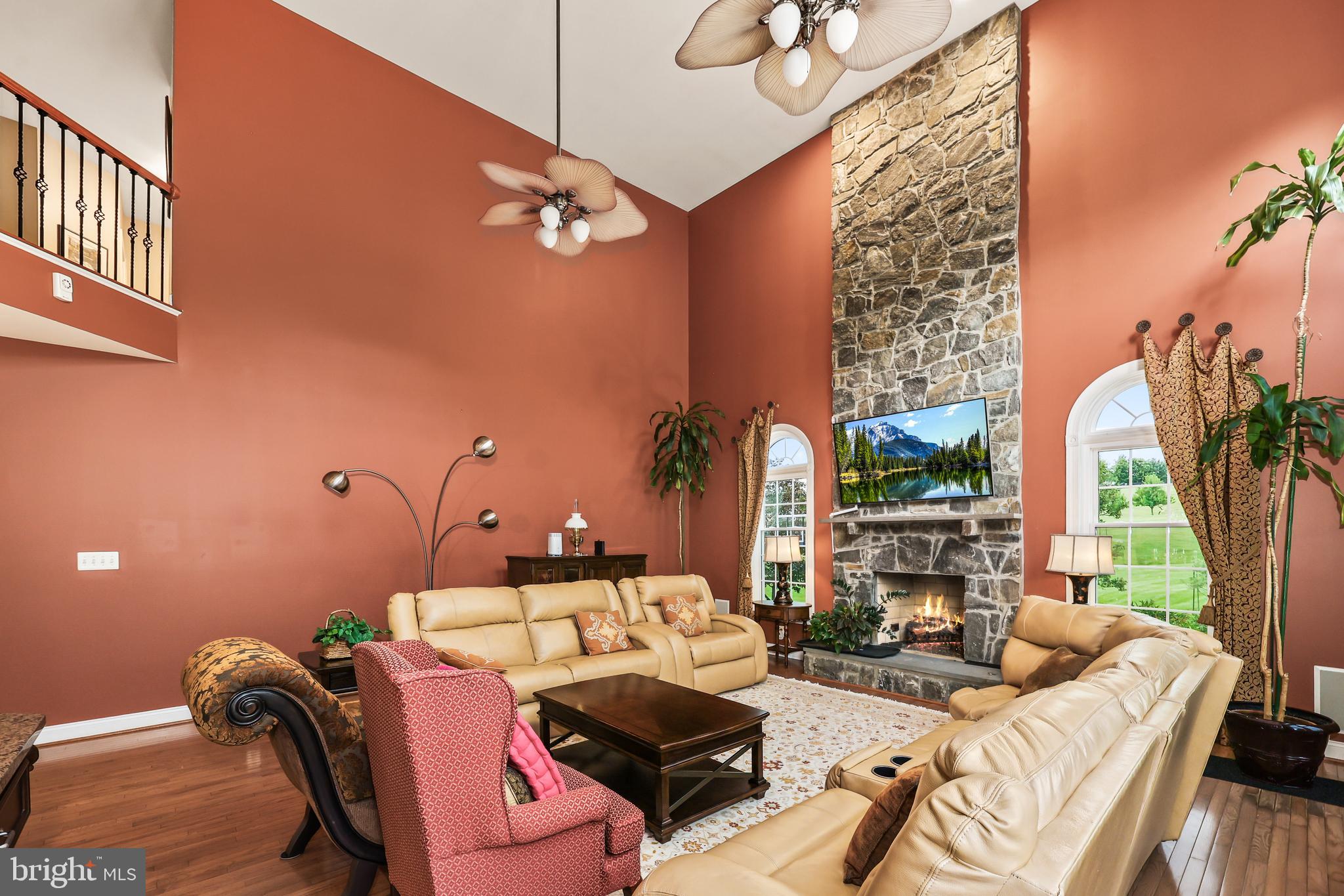 40890 Beechnut Road Leesburg, VA 20175 - Photo 24 of 65 a living room with furniture a lamp and a potted plant