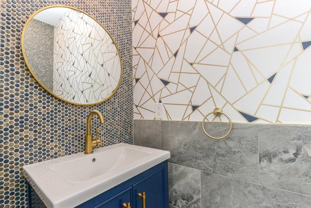 79 Holmes Road Dedham, MA 02026 - Photo 17 of 42 a bathroom with a sink and a mirror