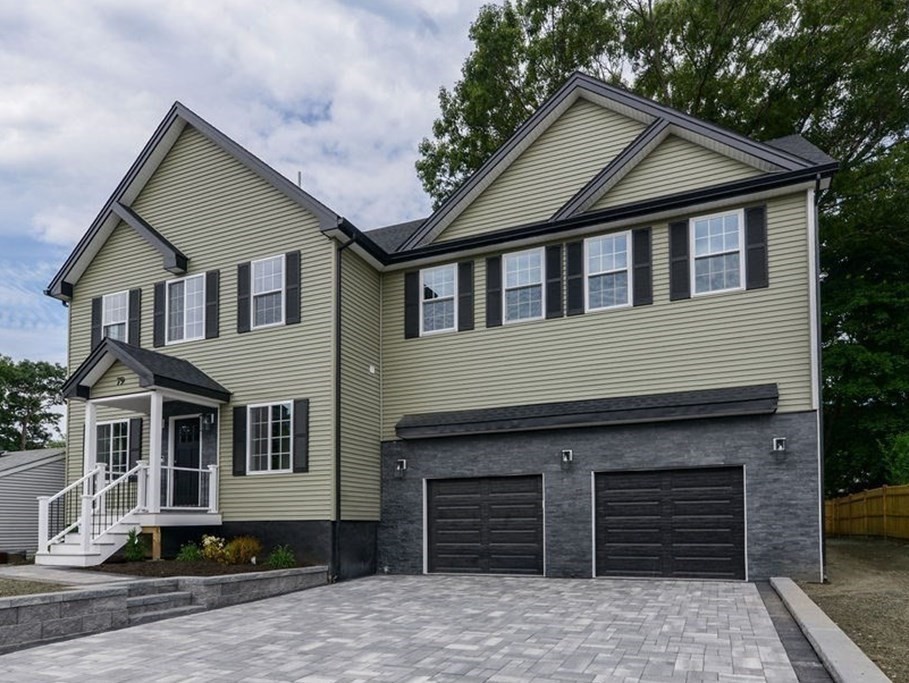 79 Holmes Road Dedham, MA 02026 - Photo 2 of 42 a front view of a house with a yard