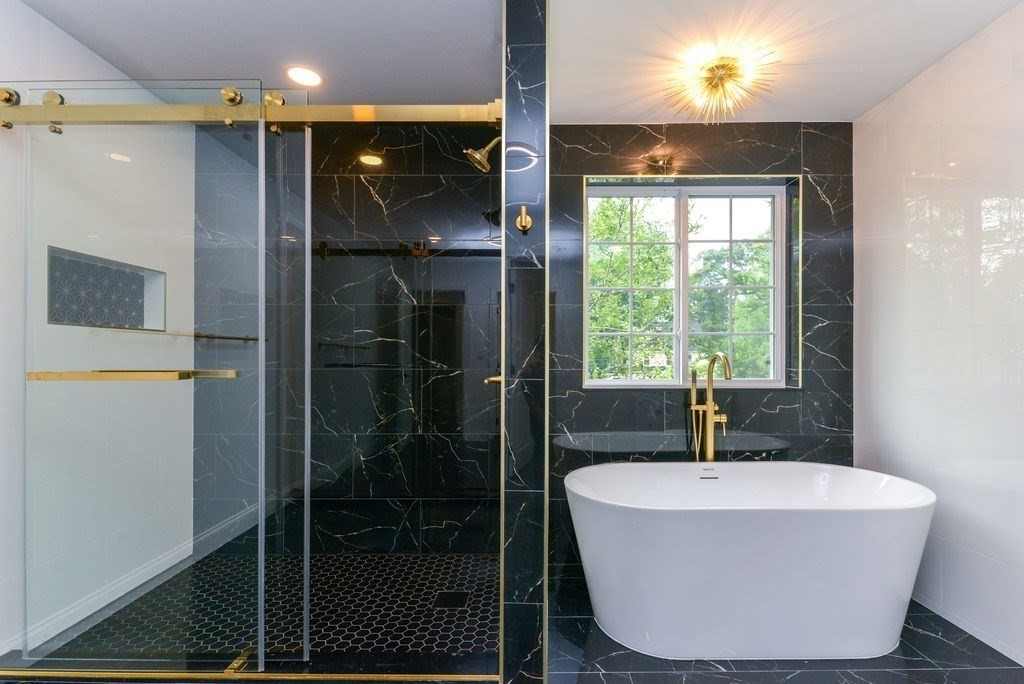 79 Holmes Road Dedham, MA 02026 - Photo 25 of 42 a white bath tub sitting in a bathroom