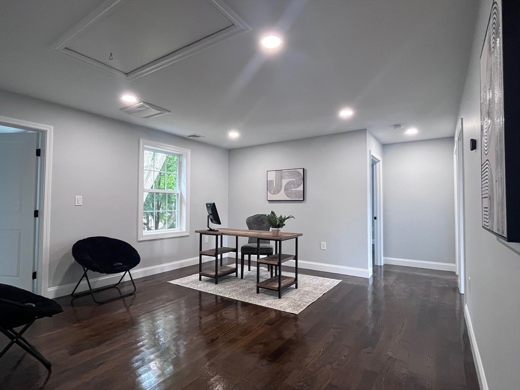 79 Holmes Road Dedham, MA 02026 - Photo 29 of 42 a dining room with furniture and wooden floor