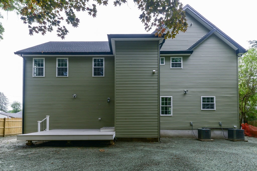 79 Holmes Road Dedham, MA 02026 - Photo 40 of 42 a view of a house with a yard