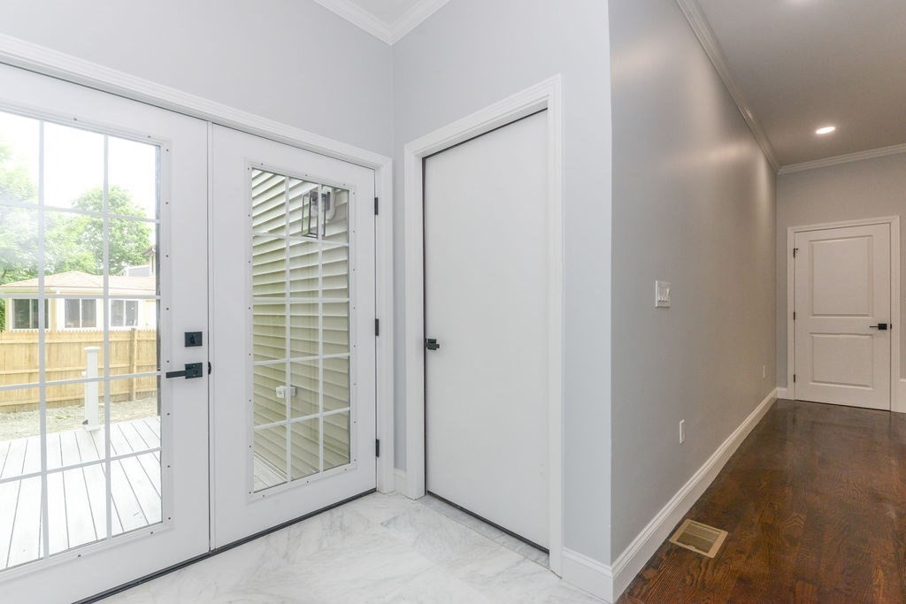 79 Holmes Road Dedham, MA 02026 - Photo 5 of 42 a view of hallway with windows