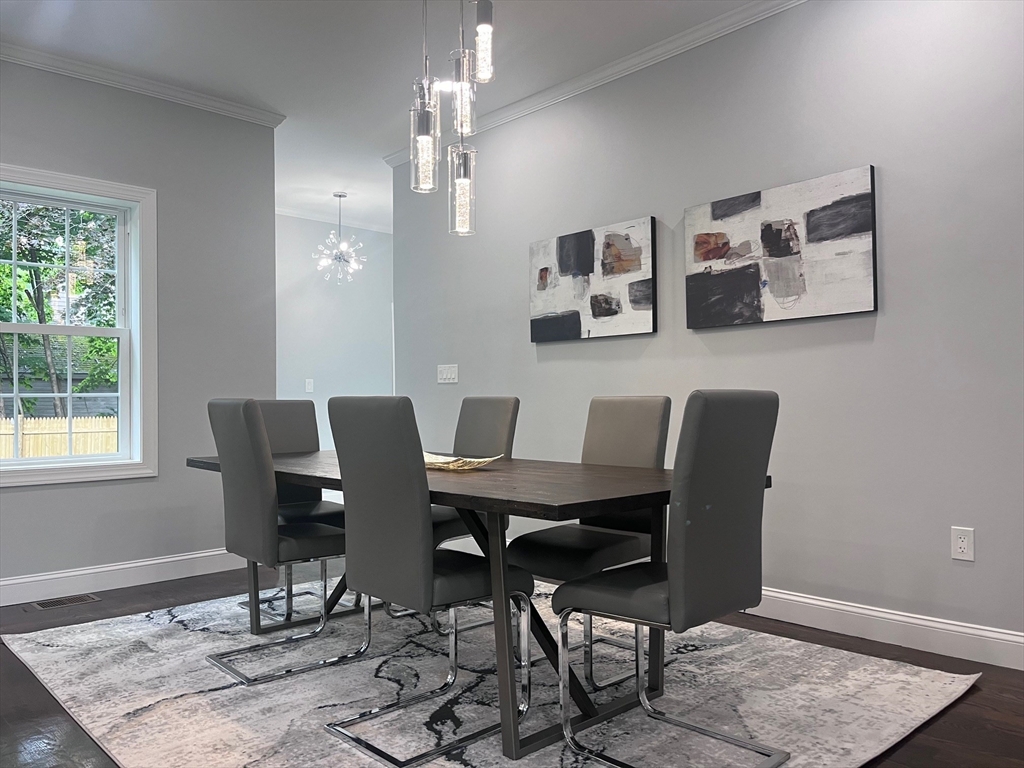 79 Holmes Road Dedham, MA 02026 - Photo 6 of 42 a view of a dining room with furniture