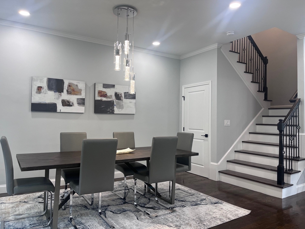 79 Holmes Road Dedham, MA 02026 - Photo 7 of 42 a view of a dining room with furniture