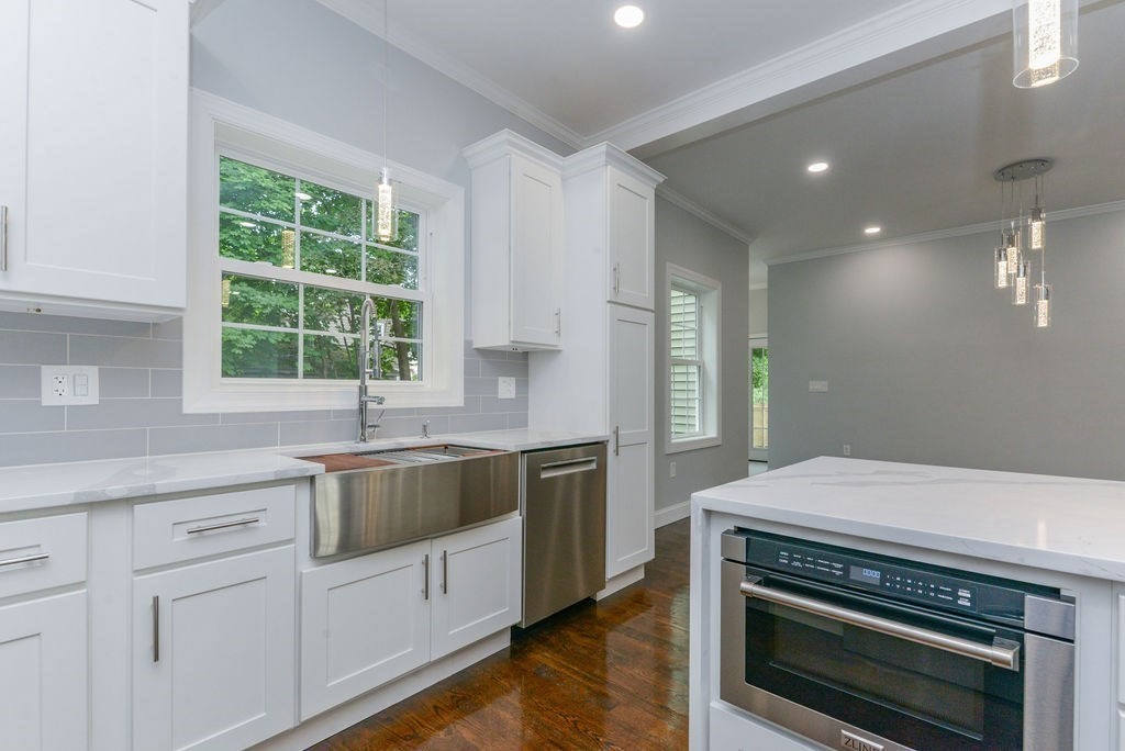 79 Holmes Road Dedham, MA 02026 - Photo 9 of 42 a kitchen with a stove and a sink