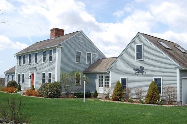 1125 N Road Hardwick, MA 01037 - Photo 2 of 41 a front view of a house with a garden and yard