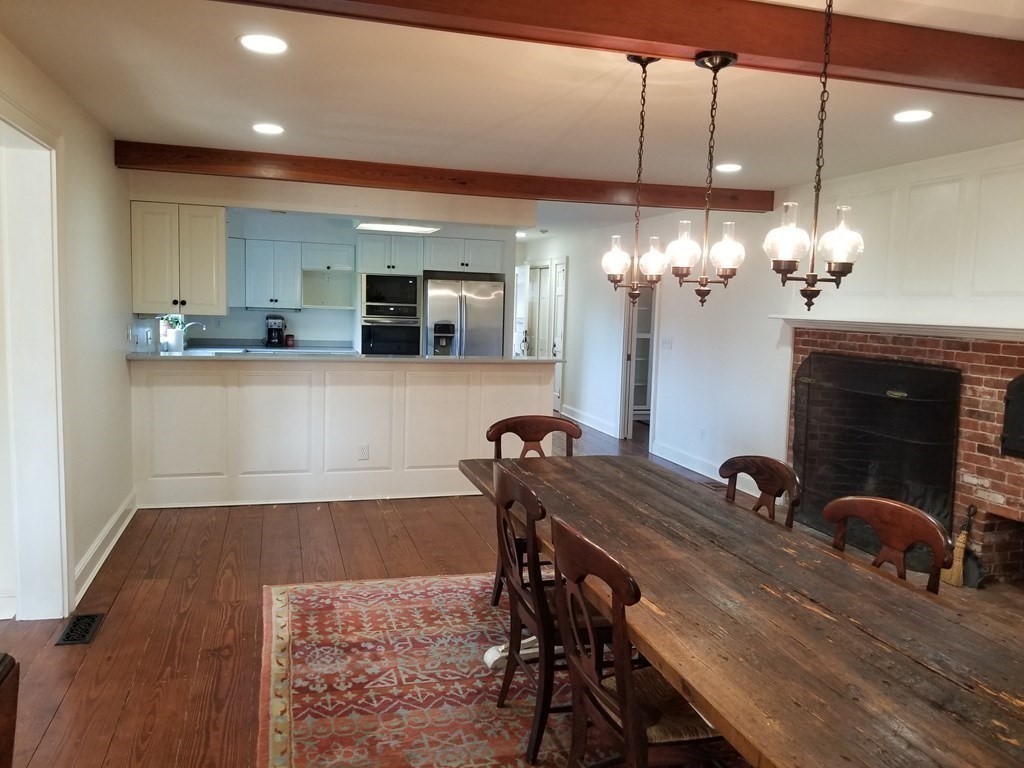 1125 N Road Hardwick, MA 01037 - Photo 22 of 41 a view of a dining room with furniture and chandelier