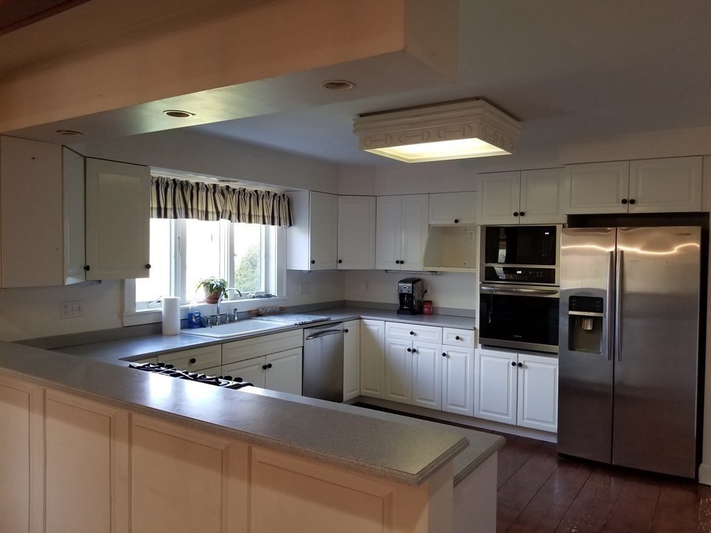 1125 N Road Hardwick, MA 01037 - Photo 23 of 41 a kitchen with granite countertop stainless steel appliances cabinets a sink and a counter top space