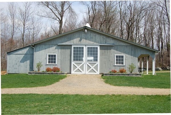 1125 N Road Hardwick, MA 01037 - Photo 7 of 41 a front view of a house with a garden