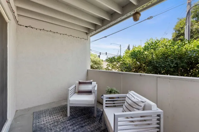 a view of balcony with furniture