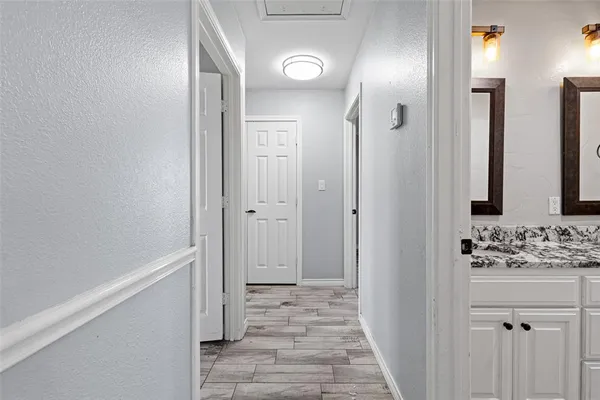 a bathroom with a sink and mirror
