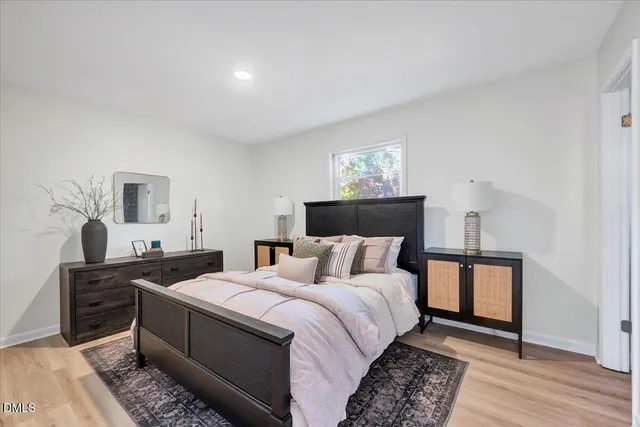 a view of an empty room and wooden floor