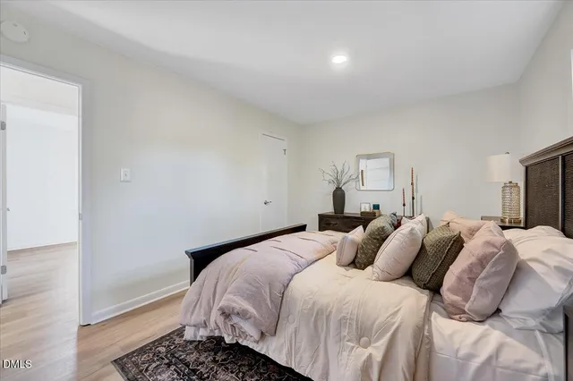 a bedroom with a bed and a dresser