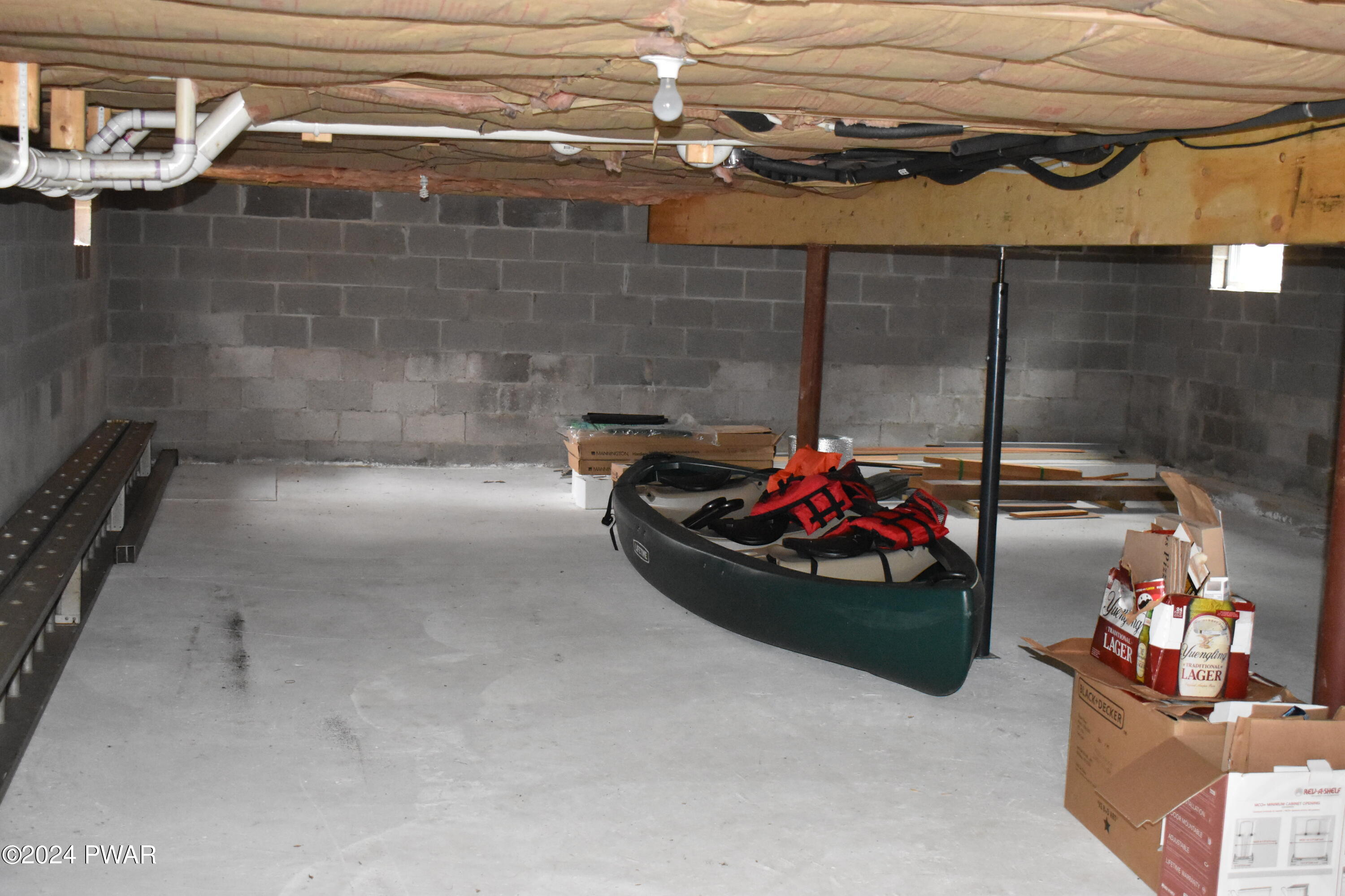 800 Rimrock Court Hawley, PA 18428 - Photo 19 of 30 a room with water heater and wooden cabinets