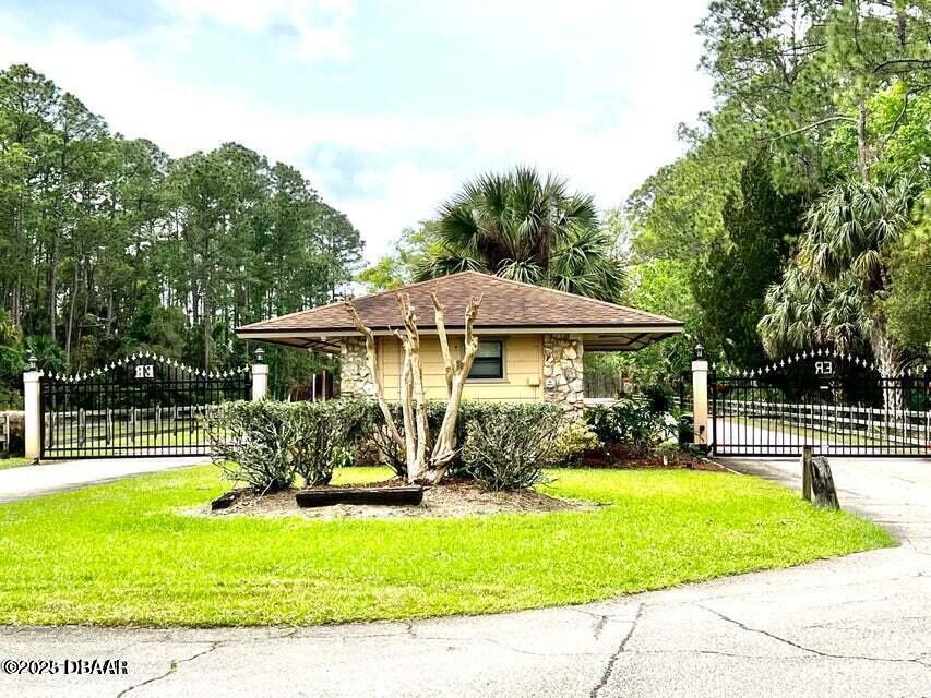 3 Remington Road Ormond Beach, FL 32174 - Photo 7 of 18 a view of a house with a swimming pool