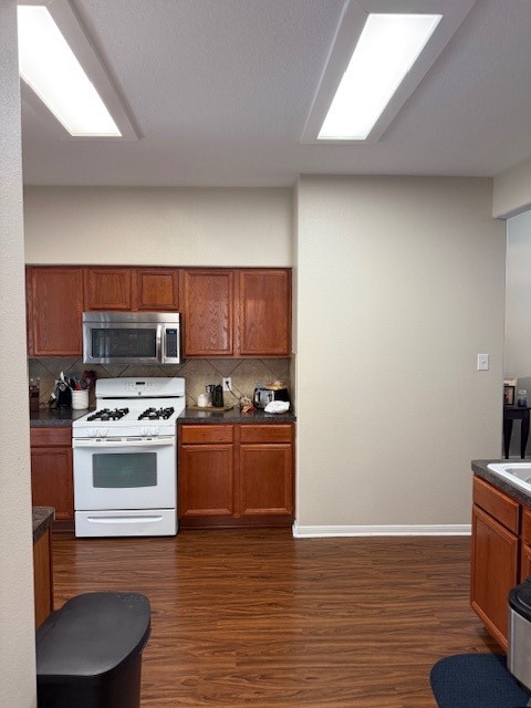 22411 High Point Pines Drive Spring, TX 77373 - Photo 7 of 12 View of kitchen stove and cabinets.