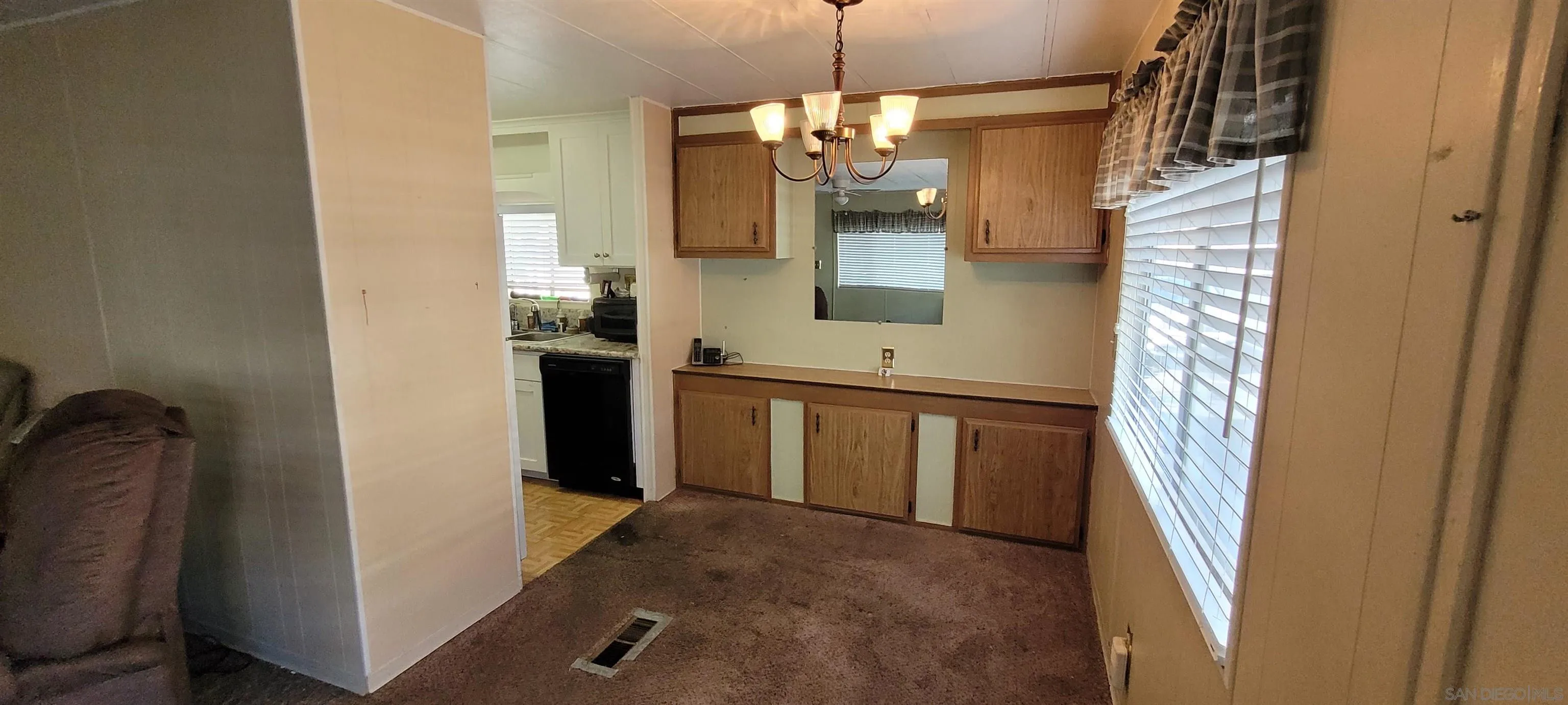 14004 Jasmine Avenue, Unit 260 Poway, CA 92064 - Photo 5 of 6 a bathroom with a sink and mirror