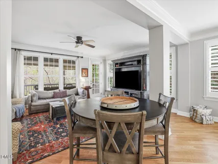 a view of a chairs and table in the balcony